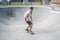 handsome skater skating in middle of pool