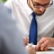 Handsome smiling bearded clerk man at office workplace