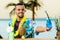 Handsome smiling Latin American bartender standing near the bar