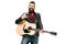 Handsome smiling musician in black leather jacket holding acoustic guitar and showing rock and roll sign, isolated