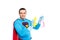 handsome smiling superman holding rag and spray bottle with detergent