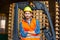 Handsome smiling worker driving forklift in warehouse. Woodworking industry concept.