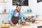 handsome smiling young barista cleaning bar counter