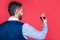 handsome sommelier in formal wear hold glass of red wine for drinking, greeting