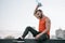 handsome sportsman pouring water from bottle on head