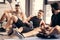 handsome sportsmen resting on yoga mats after training