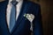 Handsome strict blue groom`s robe and blue tie. White shirt.
