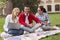 Handsome student smiling broadly spending free time with groupmates