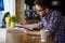 Handsome student studying in restaurant