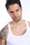 Handsome tattooed man wearing a tank top