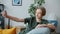 Handsome teenage boy taking selfie with smartphone camera posing with hand gestures at home