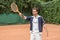 handsome tennis player pointing with wooden racket