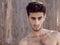 Handsome topless young man outdoors