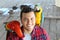 Handsome tourist interacting with macaws visiting Peru