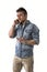 Handsome upset young man talking on cell phone (mobile)