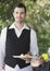 Handsome Waiter Holding Slice Of Pie At Cafe