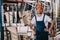 Handsome warehouse worker standing with hands