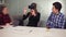Handsome woman tries app for VR helmet virtual reality glasses while her friends and colleagues supporting her in a