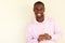 Handsome young african american man smiling with hoodie