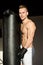 Handsome young boxer shirtless with boxing gloves