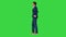 Handsome young businessman standing arms crossed, smiling confidently on a Green Screen, Chroma Key.