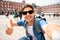 Handsome young caucasian tourist man happy and excited taking a selfie in Plaza Mayor, Madrid Spain