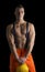 Handsome young construction worker with orange suit and hardhat