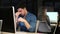 Handsome young entrepreneur working with the computer in the office at night