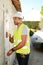 Handsome young foreman supervising a house renovation contruction site