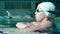 Handsome Young girl Emerges from Under Water in the Swimming pool.