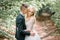 Handsome young groom kisses bride tenderly