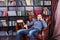 Handsome Young Guy Sitting on the Library Chair