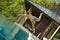 Handsome young lifeguard plunge in swimming pool to rescue.