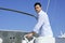 Handsome young man on boat, summer vacation