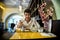 Handsome young man having lunch in elegant restaurant