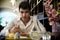 Handsome young man having lunch in elegant restaurant