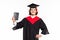 Handsome young man holding graduation diploma  on white background