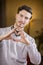 Handsome young man making heart sign with hands