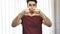 Handsome young man making heart sign with hands