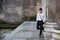 Handsome young man outdoor next to ancient marble columns