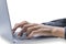 Handsome young man playing computer. Or printing financial and business information. On a white backdrop