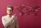 Handsome young man pointing at world flight map on color background