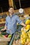 Handsome young man shopping for fruits in supermarket