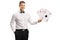 Handsome young man in a tux holding playing cards