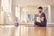 Handsome young man using wireless robot camera during yoga session