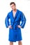 Handsome young man wearing blue bathrobe, isolated