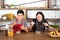 Handsome young men having breakfast,one man hand sign thumb up and the other finger point to spoon in modern dining room apartment