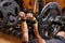 Handsome young muscular man close up, doing bench french press workout with barbell in gym.