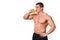 Handsome young muscular sports man drinking juice isolated