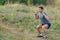 Handsome young muscular sports man exercising outside outdoor with rubber band.